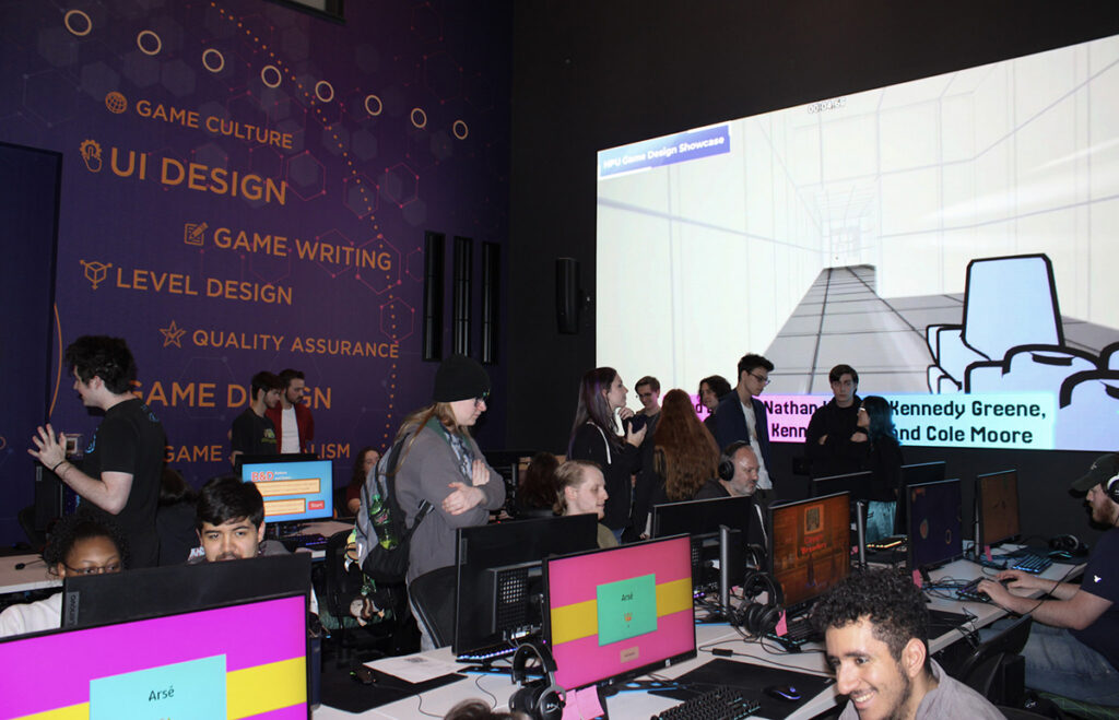 HPU’s Game Developers Conference included a showcase where designers played games created by students and shared meaningful design discussions.