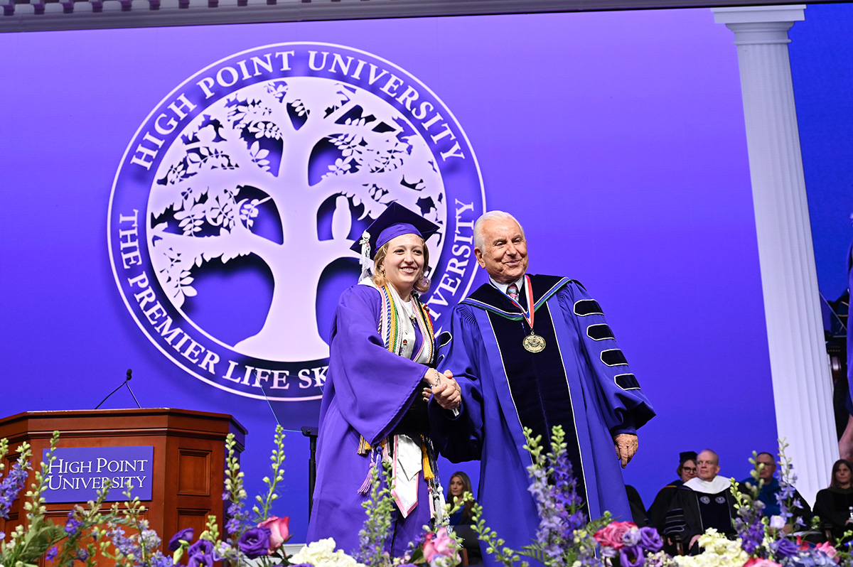 Qubein shook new graduate Isabella Vitali's hand after she paused on stage to have her photograph taken with him.