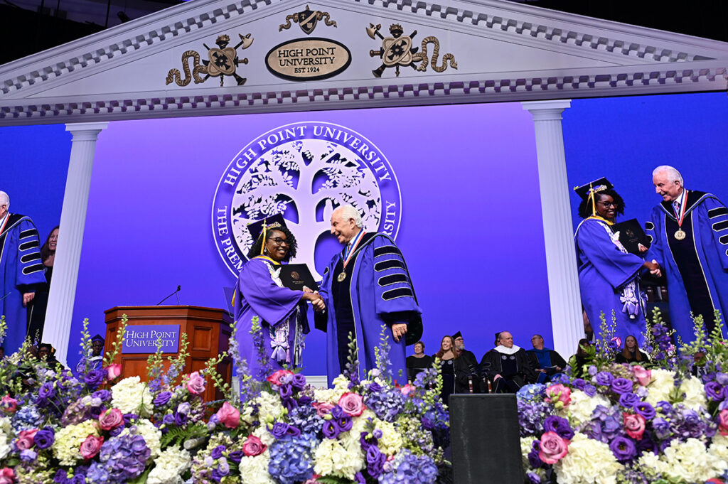 A graduate shook Qubein’s hand as she crossed the stage during Commencement.