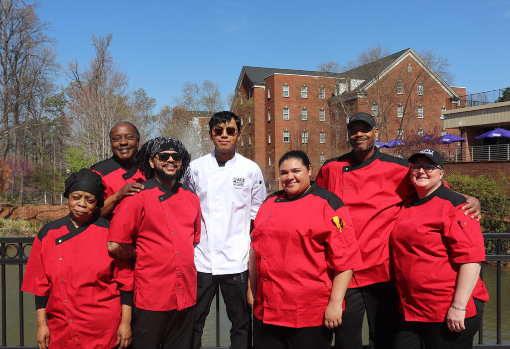 Pictured outside the Slane Student Center Café are Harvest Table Culinary Group members Kassie Malloy, left, Urshela Harrison, John Lester, Chunlee Tith, Azil Collazo-Diaz, Robert Lucas and Stephanie Strucinski.