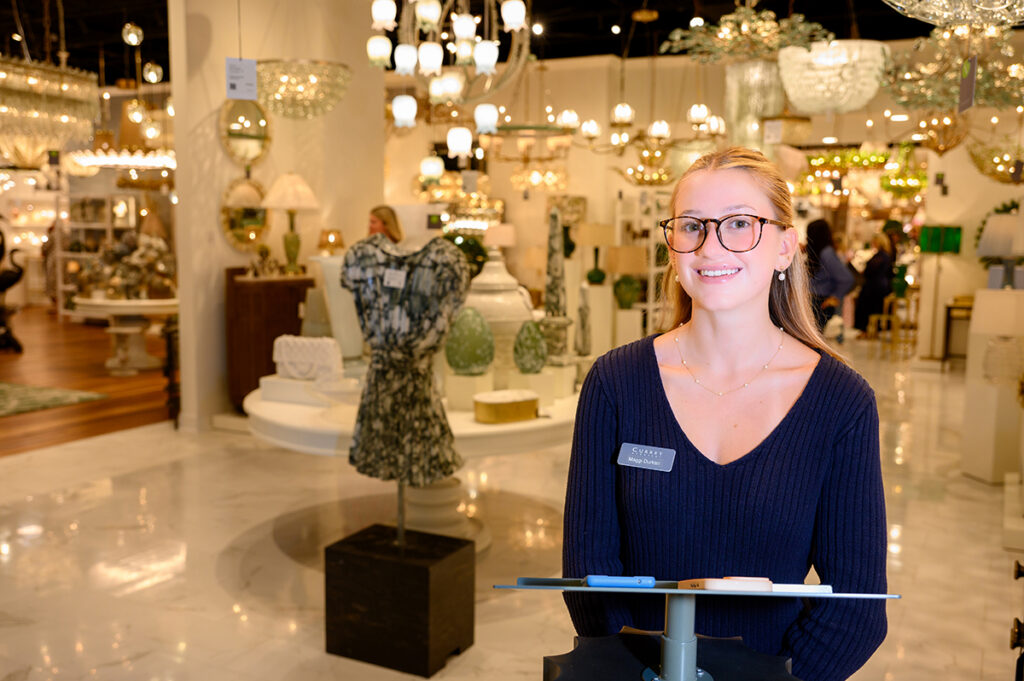 Maggi Durkan, a junior business administration major from Delray Beach, Florida, worked as a greeter and door scanner for Currey and Company.