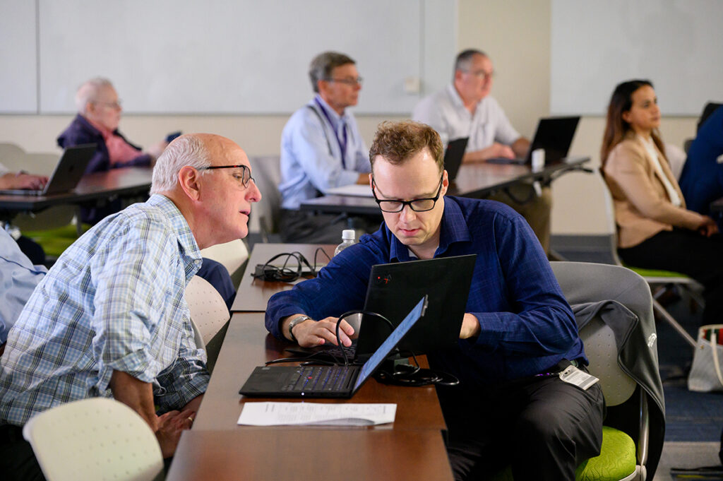 Faculty confer on practical AI strategies to use in their classrooms.