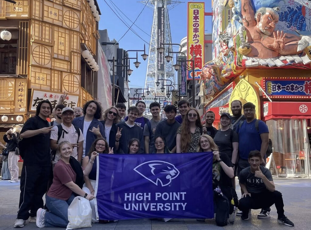 HPU Japanese Media and Popular Culture students were shown in the Shinsekai area of Osaka, with a bit of Tsutenkaku Tower visible in the background.