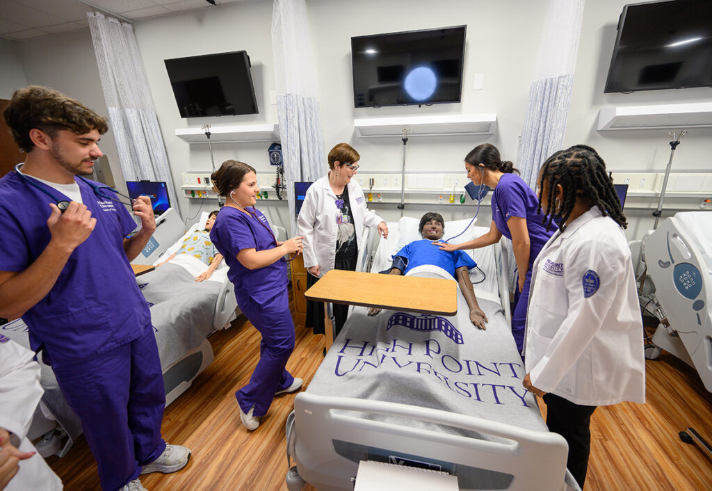 HPU nursing students were pictured with faculty in a simulation lab on campus.