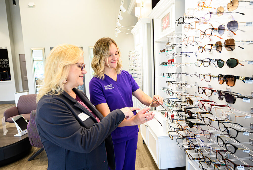 Kathy Diz, a HPU Eye Health optical sales representative, and Faith Thompson review glasses frame options.