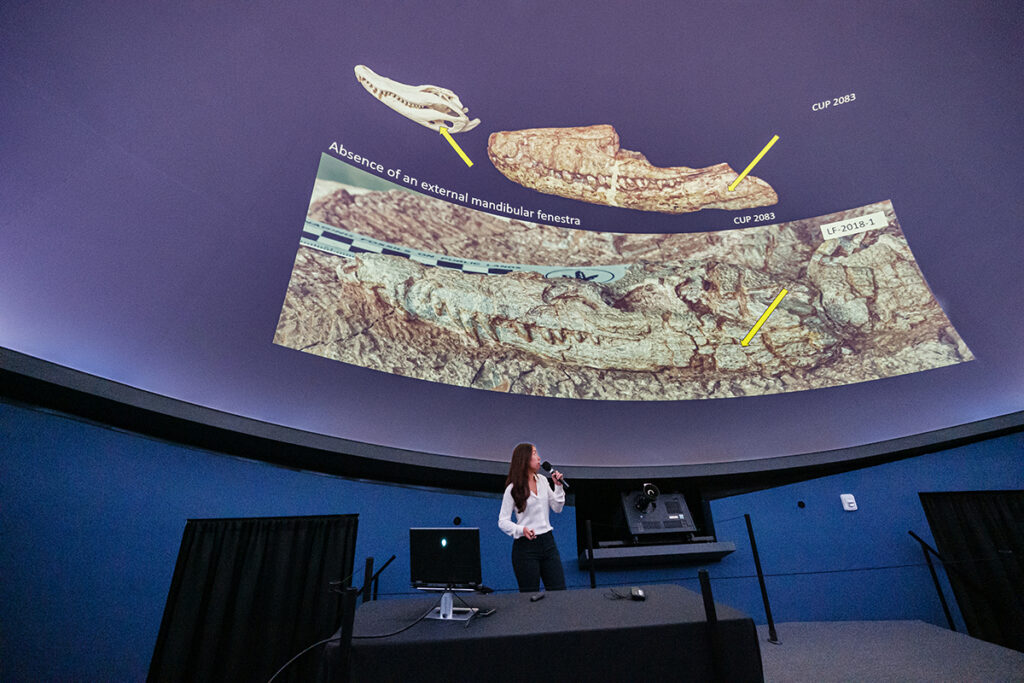 Biology major Eleanor Lee answered questions about her research on vertebrate fossils, with a focus on dinosaur fossils that team member and fellow biology major Justin Allan helped collect this summer in northern New Mexico.