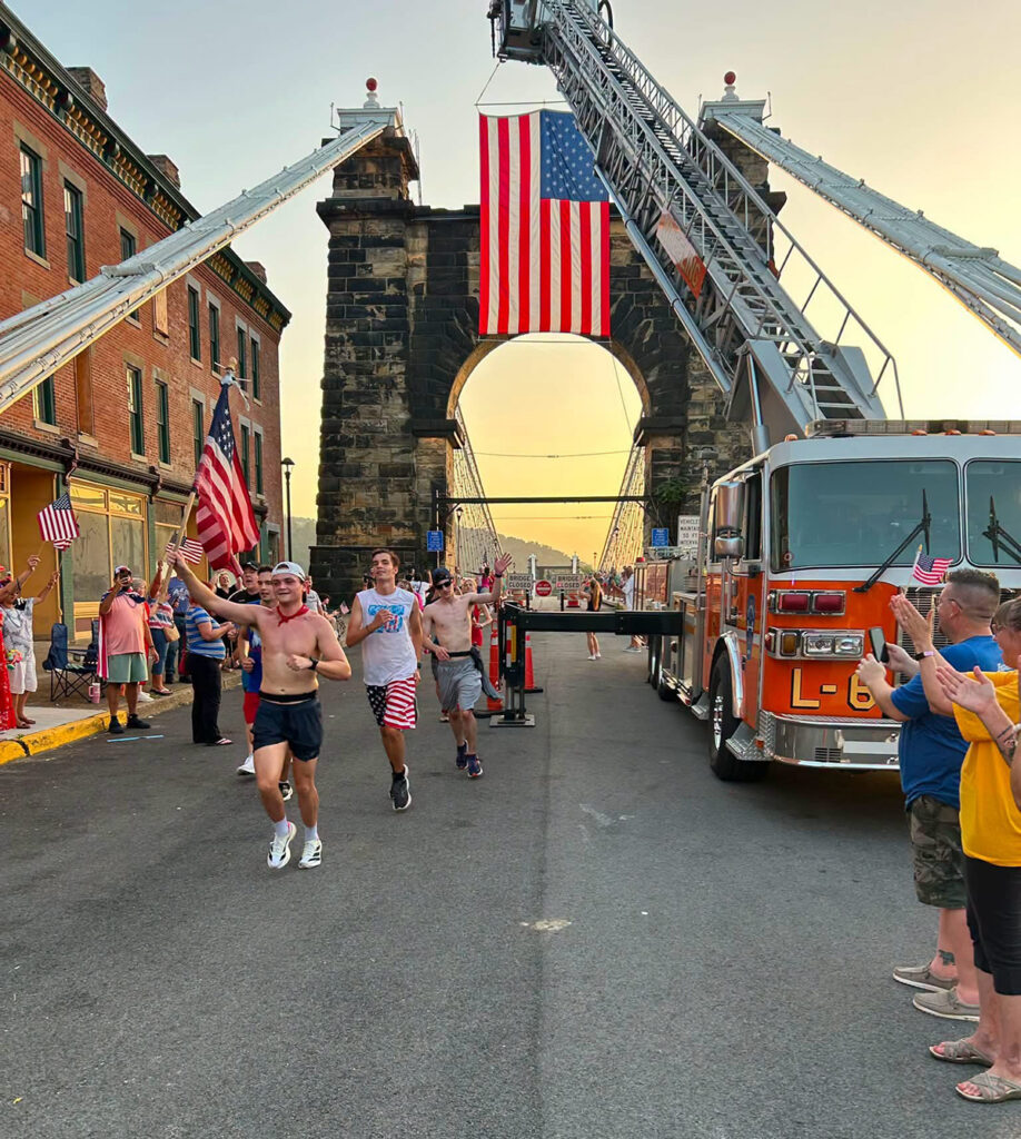 John Michael Zimmerman, a senior exercise science major, carried the American flag across the Ohio River as he ran during the Relay for America.