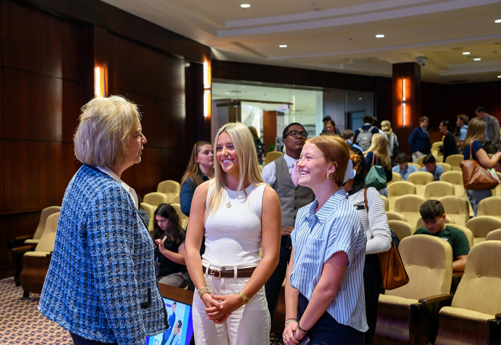 Turner talked with several students who stayed to ask more questions after her session on sharing the secret to service and leadership excellence.