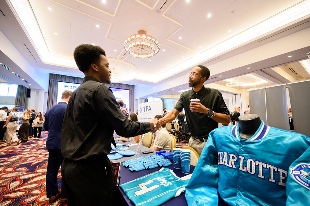 An HPU student greeted a representative of the NBA’s Charlotte Hornets.