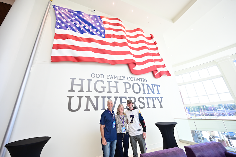 people in front of American flag mural