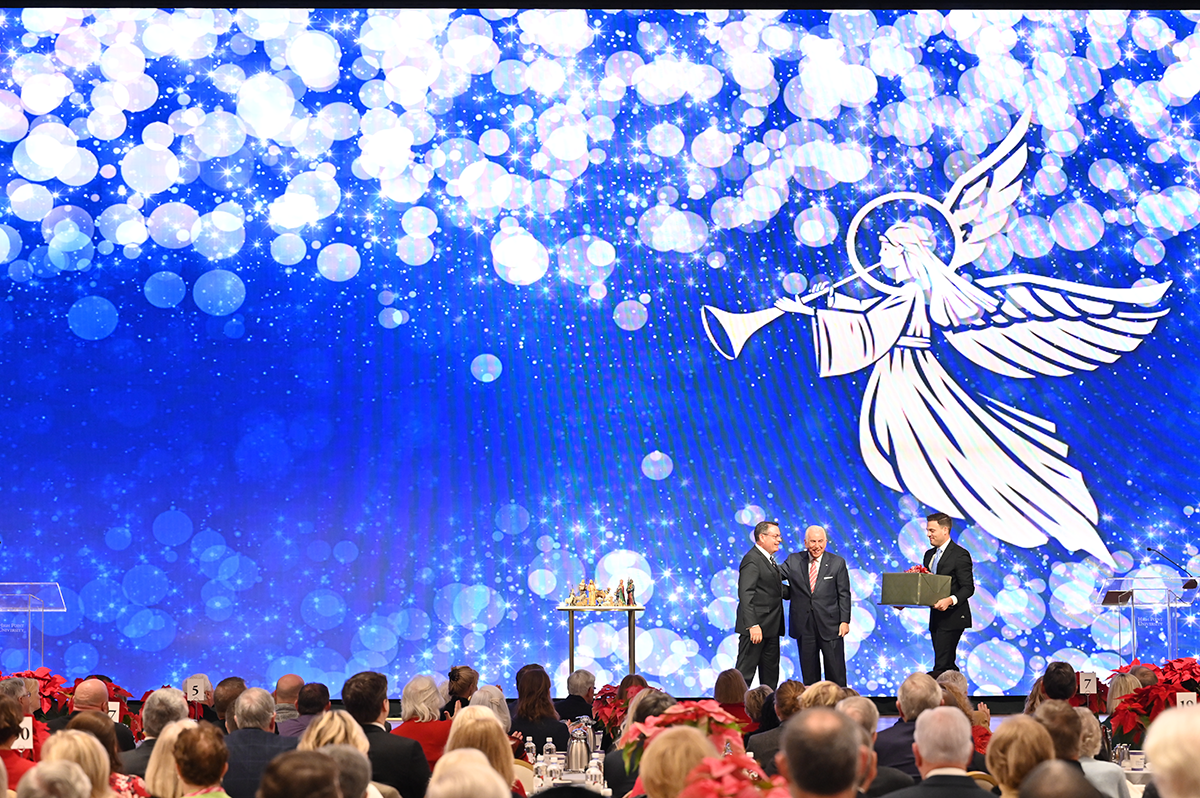 Pastor Hodges gifts Dr. Qubein with a hand-carved Nativity