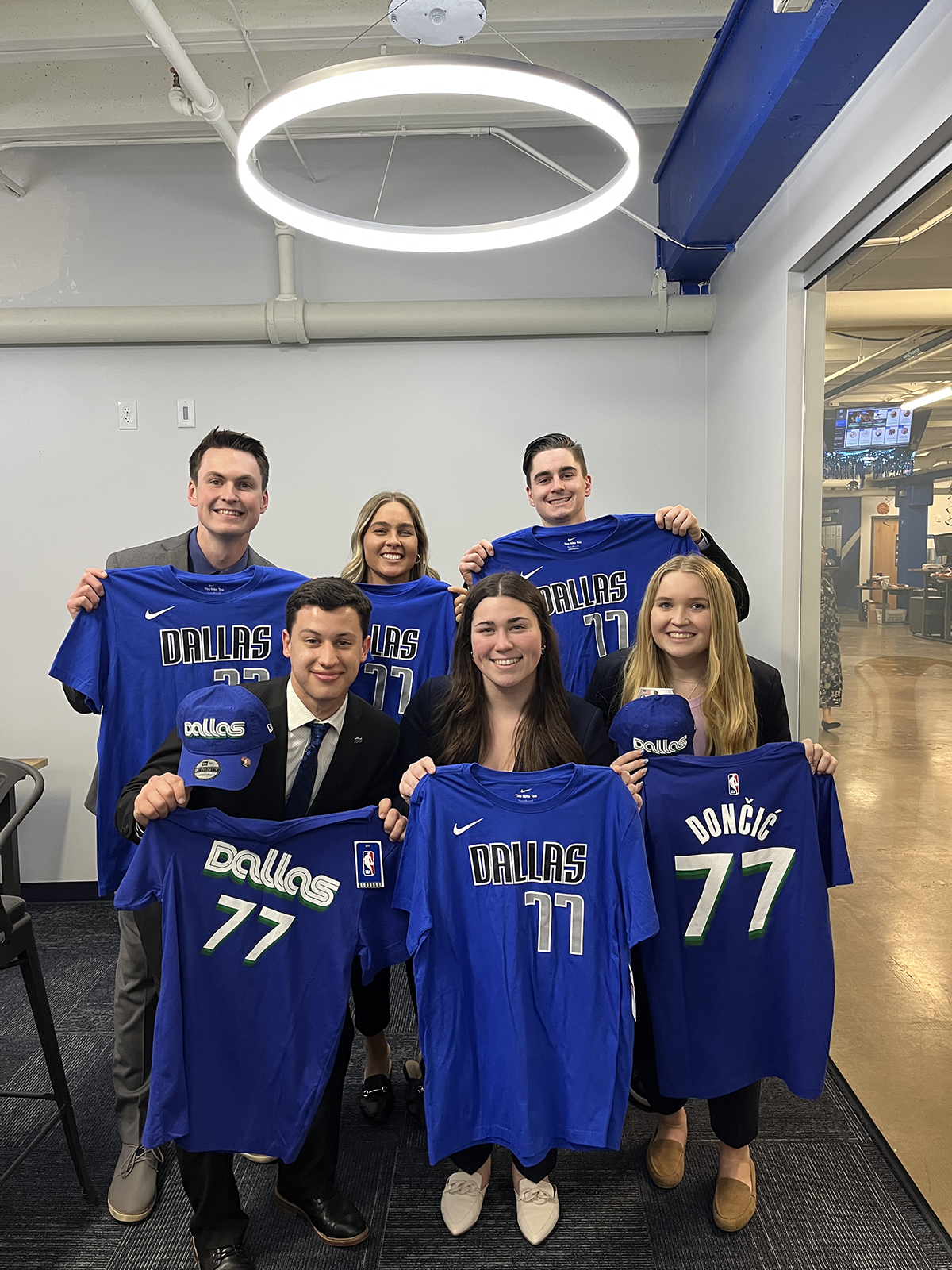 Borovskiy is pictured at center of front row with other HPU students during her Dallas Mavericks externship.