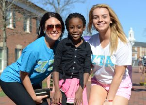 The photo features from left to right Kristen Kukla, Kayla Watkins and Hayley Pettengil at the Easter egg hunt