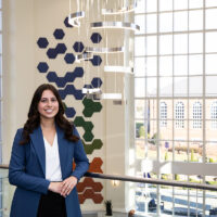 HPU senior Grace Todd, a biochemistry major from Johnsontown, Ohio, was accepted to six medical schools and plans to attend Ohio University’s Heritage College of Medicine after graduation. She is pictured in the Wanek School of Natural Sciences, where orange, green and blue colors climbing the lobby’s walls represent the earth’s core, surface and atmosphere.