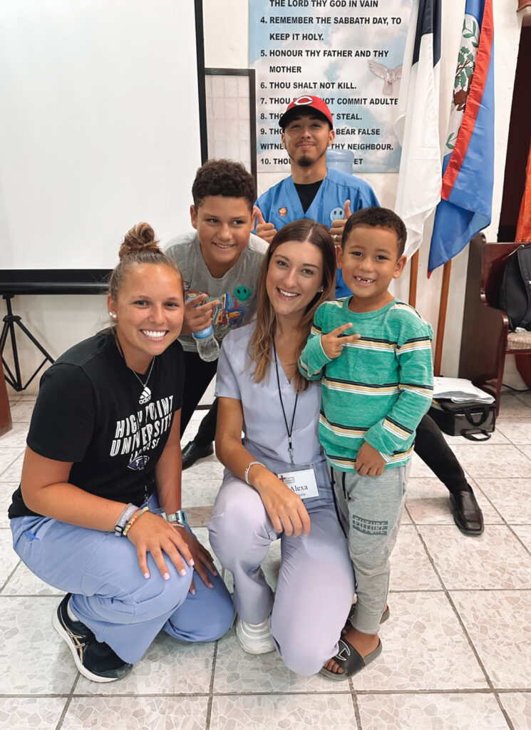 HPU pharmacy students Jenna Brady, left, and Alexa Czerw meet with patients at Caring Partners International’s medical mission clinic Orange Walk, Belize.