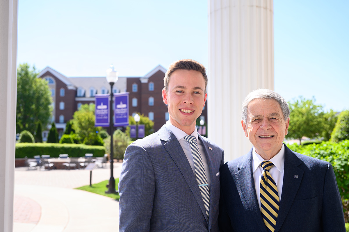 Ben Smid on campus with Larry Quinn, chair of the Department of Marketing and Sales and director of the Professional Selling Program.