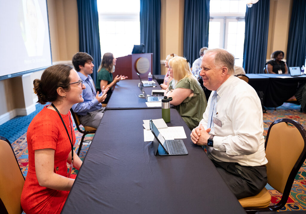 Andrea Zaglin, a sophomore nursing major from Atlanta, Georgia, smiles as she talks with Andy Modlin, senior associate vice president for graduate admissions, during her elevator pitch. 