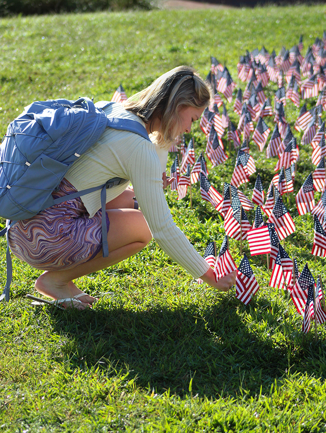 An HPU student recognizes the anniversary of the Sept. 11, 2001, terrorist attack by placing a flag in the display.