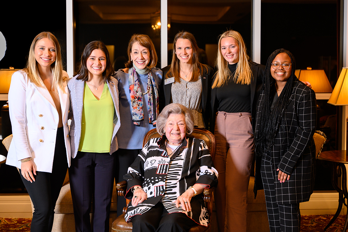 Members of the inaugural Strickland Women’s LIFT Fellowship surround founder Elizabeth Miller Strickland.
