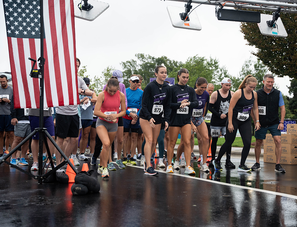 The 5K Family Run gets started despite rainy conditions.