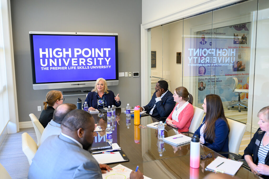 Turner, center, meets with HPU Career Coaches to discuss the current work climate. 