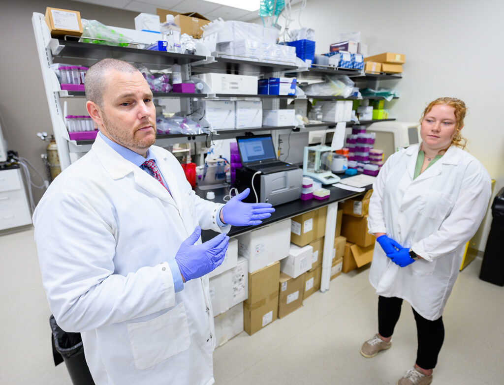 Dr. Roger Vaughan, associate professor in the Department of Exercise Science, works with student Lindsey VanDerStad to give muscle cells insulin resistance, which mimics type 2 diabetes.