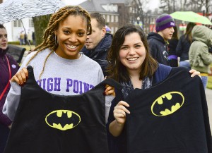 Theatre majors Danielle Criss (left) and Ashton Hunt hold up two of the capes they worked on for the project. 