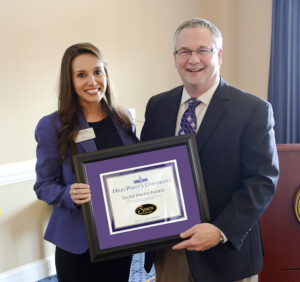 The photo features Natalie Haire and Gary Simon, owner of Simon Jewelers, who received the Social Media Award. 
