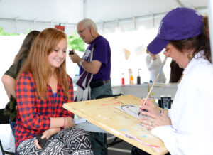 Halli Hogan has an abstract portrait of herself painted by Kate Guy.