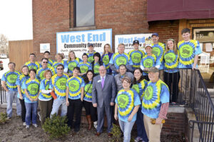 The photo features students and parents that volunteered together.