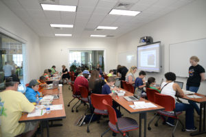 Participants of last year’s LEGO Day do robotics, engineering and design activities.
