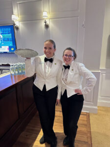 Pictured from left is Grace Savoca, an High Point University junior, and Sophia Sorrentino, another junior, working as servers at The Masters.