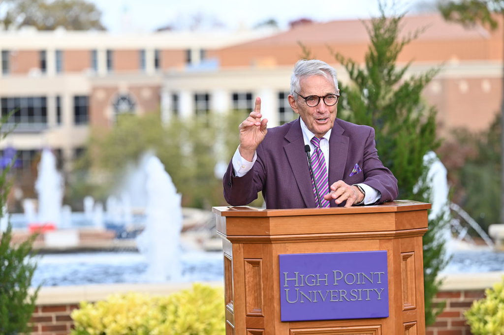 Jerry W. Murdock speaking at the podium for HPU Patriots Plaza Dedication 2