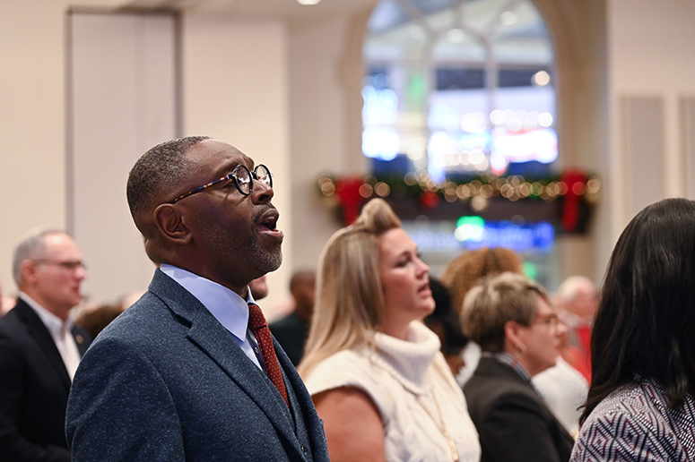Community members sing along to carols during the Annual Christmas Breakfast at the Nido and Mariana Qubein Conference Center. 