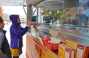 HPU staff member Kristen Russell receives her free, customized mac and cheese bowl.