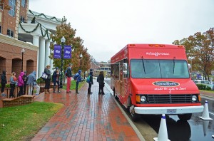Students wait in line for the Stouffer’s Food Truck in front of the R.G. Wanek Center. 