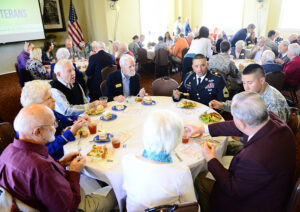 The HPU community and veterans from Pennybyrn share lunch and conversation together.