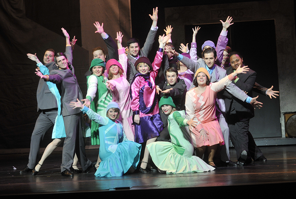 The cast of “Thoroughly Modern Millie” poses following their performance.