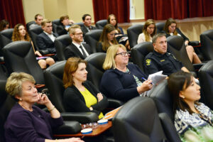 The photo features members of the High Point Center for Children and Families advisory board as students offer creative fundraising ideas and campaigns for HPCCF.