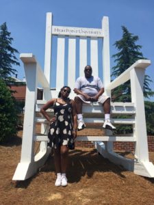 Bydume and her father on the "Dream Big" chairs in David R. Hayworth Park