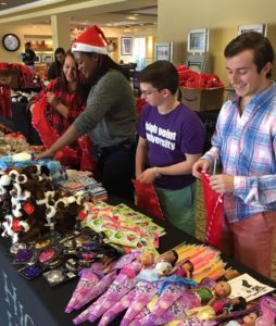Bydume works with fellow SGA members for the Salvation Army's "Stuff a Stocking" campaign
