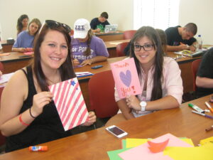 Lizzie O'Brien and Emily Meoli while they work on their cards.