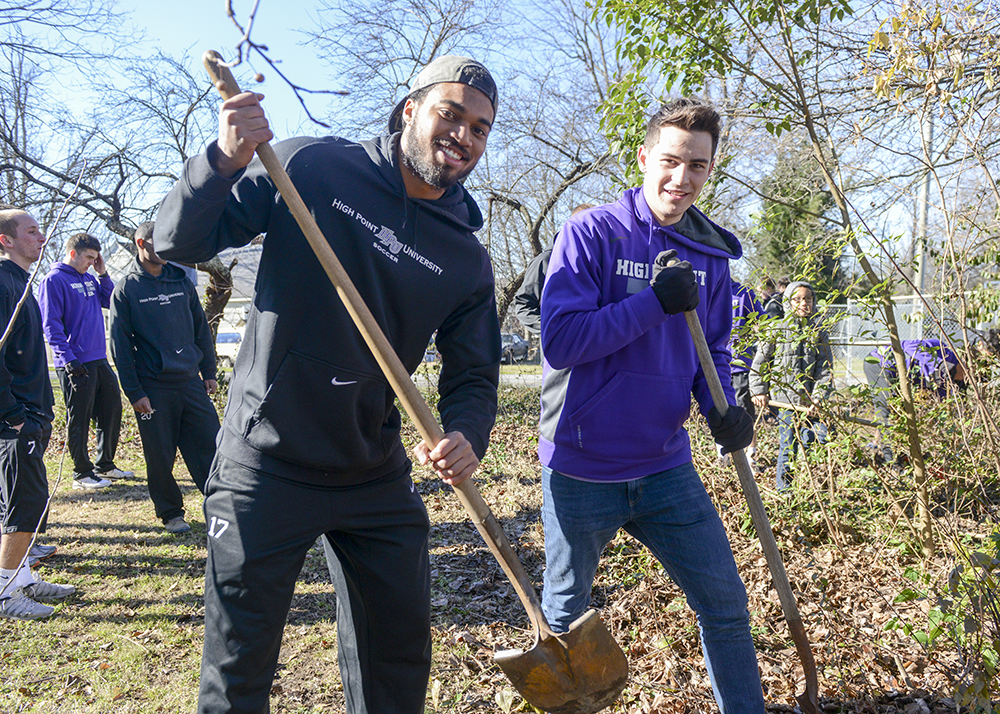 HPU students Erien Campbell (left) and Chris Ramsell do landscaping at West End Ministries during last year's Day of Service. 