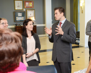 The photo features HPU student Devon Thomas (left) and McComb (right).