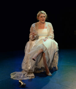 The photo features Charlotte Adams in the play “The Most Beautiful Footsteps,” written by Rachel Garret.  