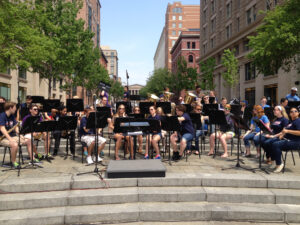The HPU Wind Ensemble prepares to perform near the U.S. Navy Memorial in Washington, D.C.