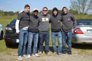 From left to right, Sigma Nu fraternity members John O'Reilly, Austin Thomas, Nick Pierle, Matthew Cloer and Alex Rovatsos enjoy the Car Show held on April 9. 