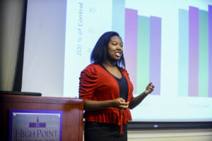 HPU student Nicole Wright presents her research on “Combinatorial Effects of Antibiotics and Manuka Honey on Escherichia coli” at HPU’s Summer Undergraduate Research Program in the Sciences (SuRPS) Final Symposium.
