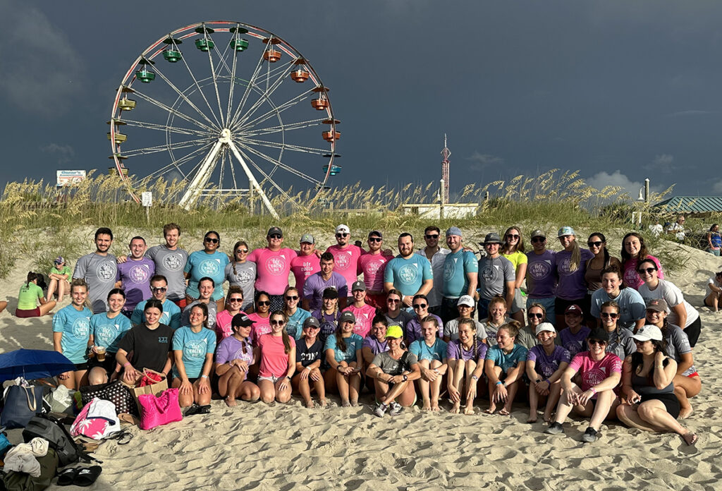 Some of the 58 HPU physical therapy students who volunteered for an annual one-day adaptive surfing clinic for disabled people at Carolina Beach, North Carolina.