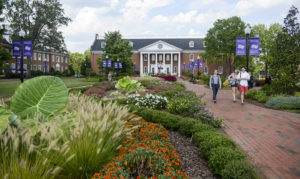 Students walk through the Arboretum and Botanical Gardens outside of Smith Library. 